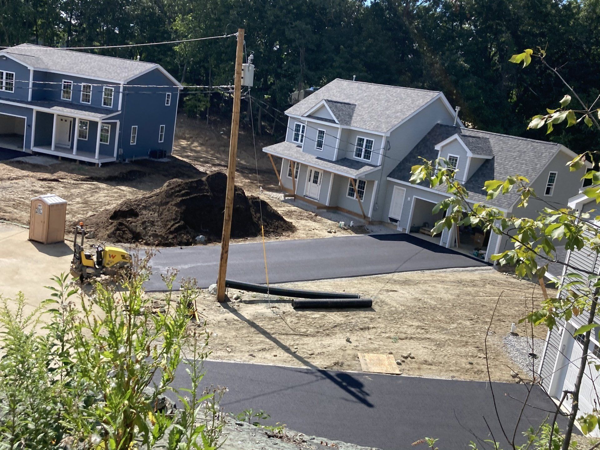 A row of houses are being built in a residential area