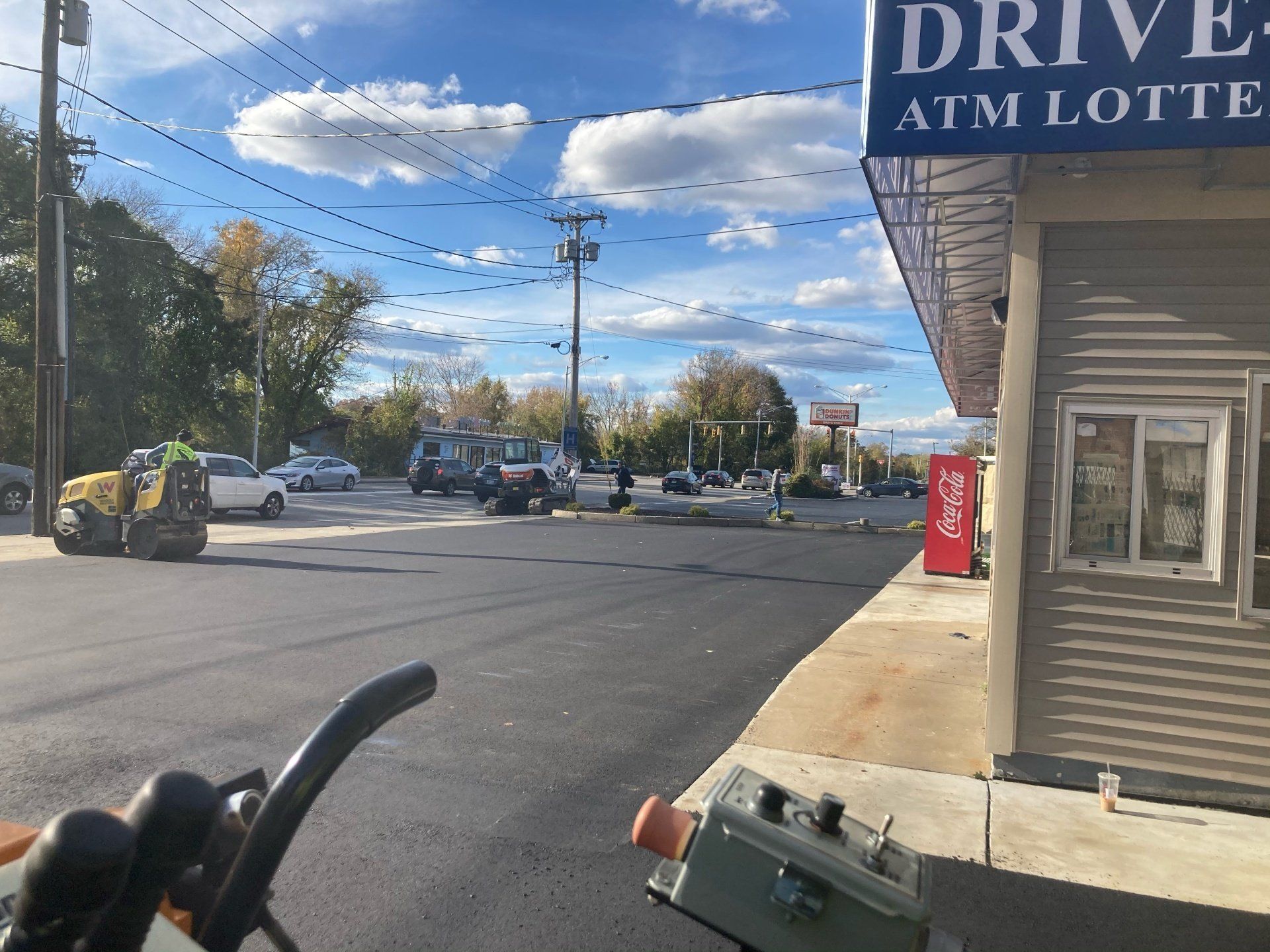 A drive atm lotte is located on the side of the road