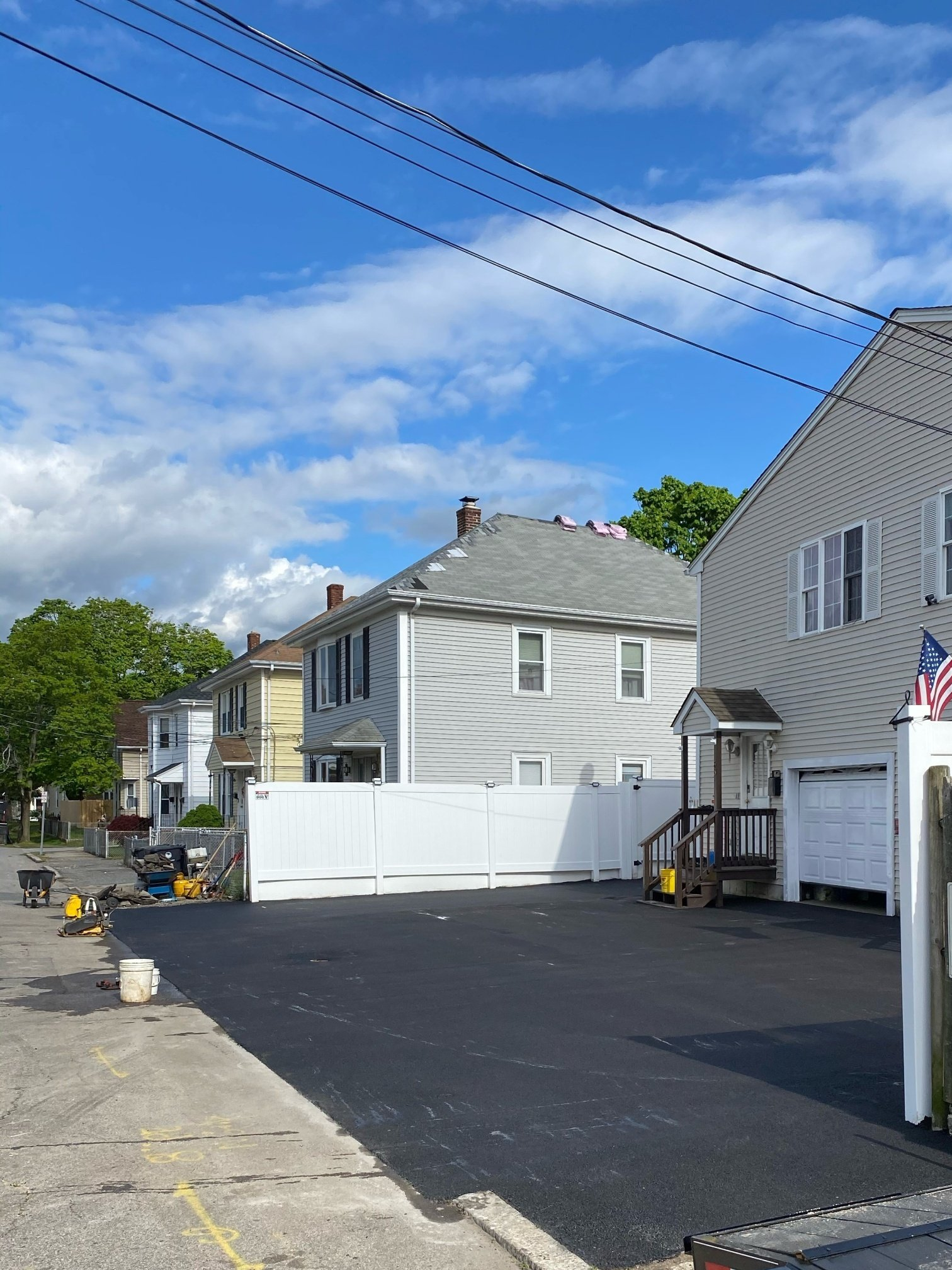 A house with a white fence in front of it