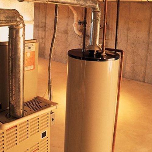 A water heater and furnace in a basement setting; both have exhaust pipes