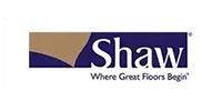 Shaw flooring logo with a navy blue and gold design, with white text that reads 