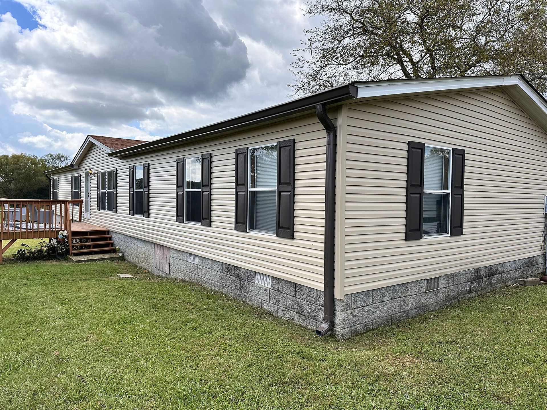 A home with black gutters and downspout.