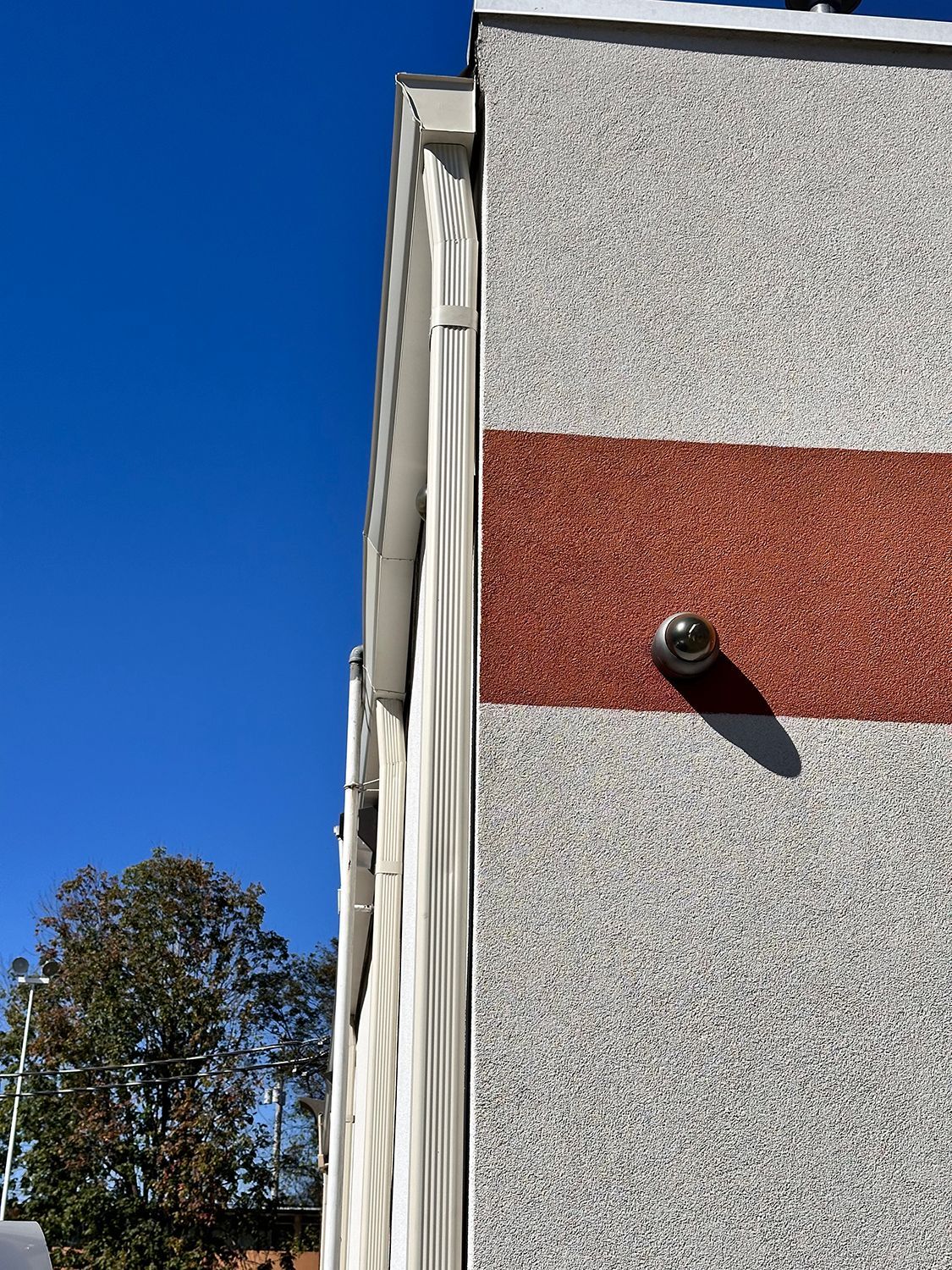 A building with a red and white stripe on the side