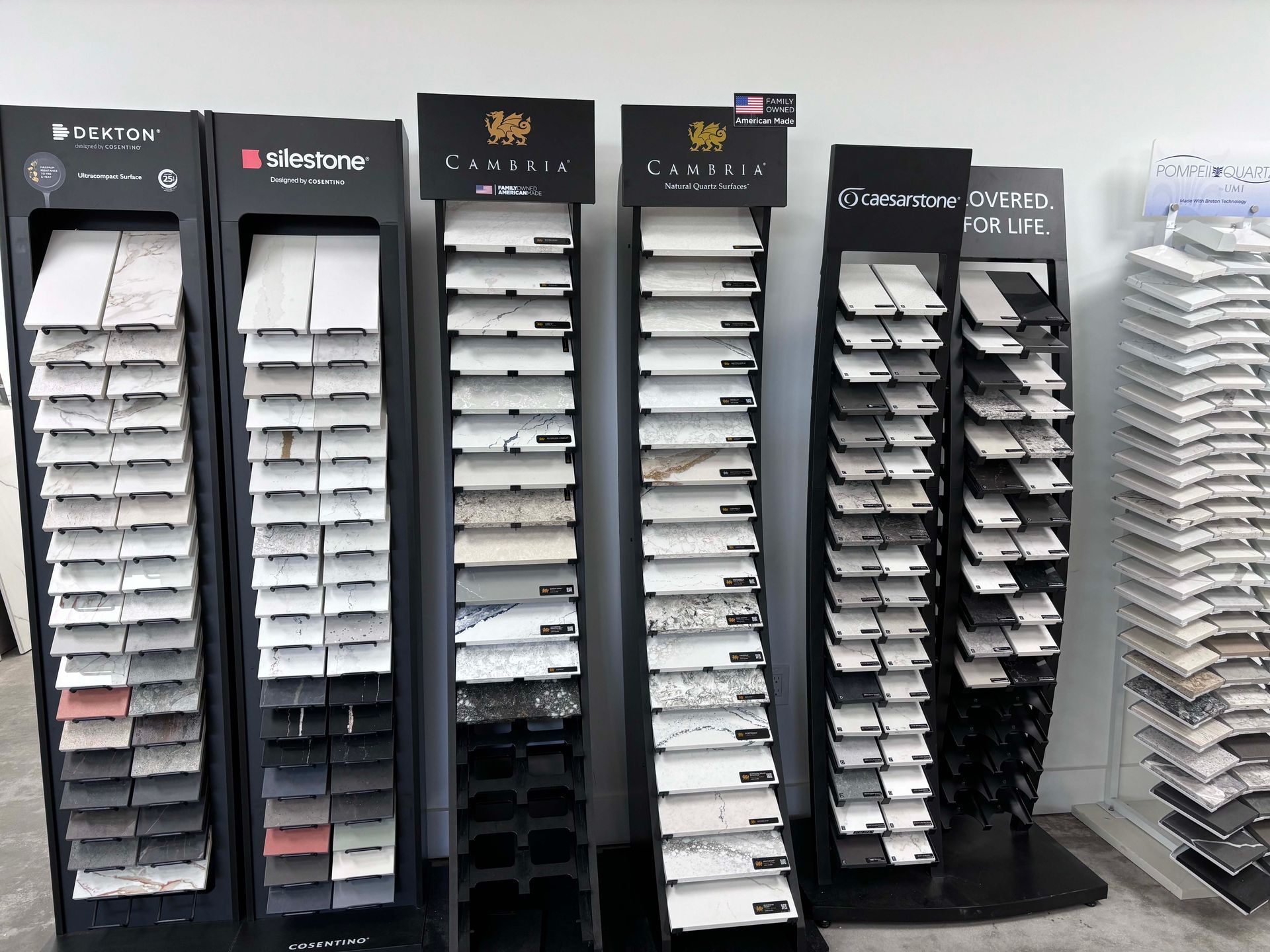 A row of display stands filled with different types of tiles.