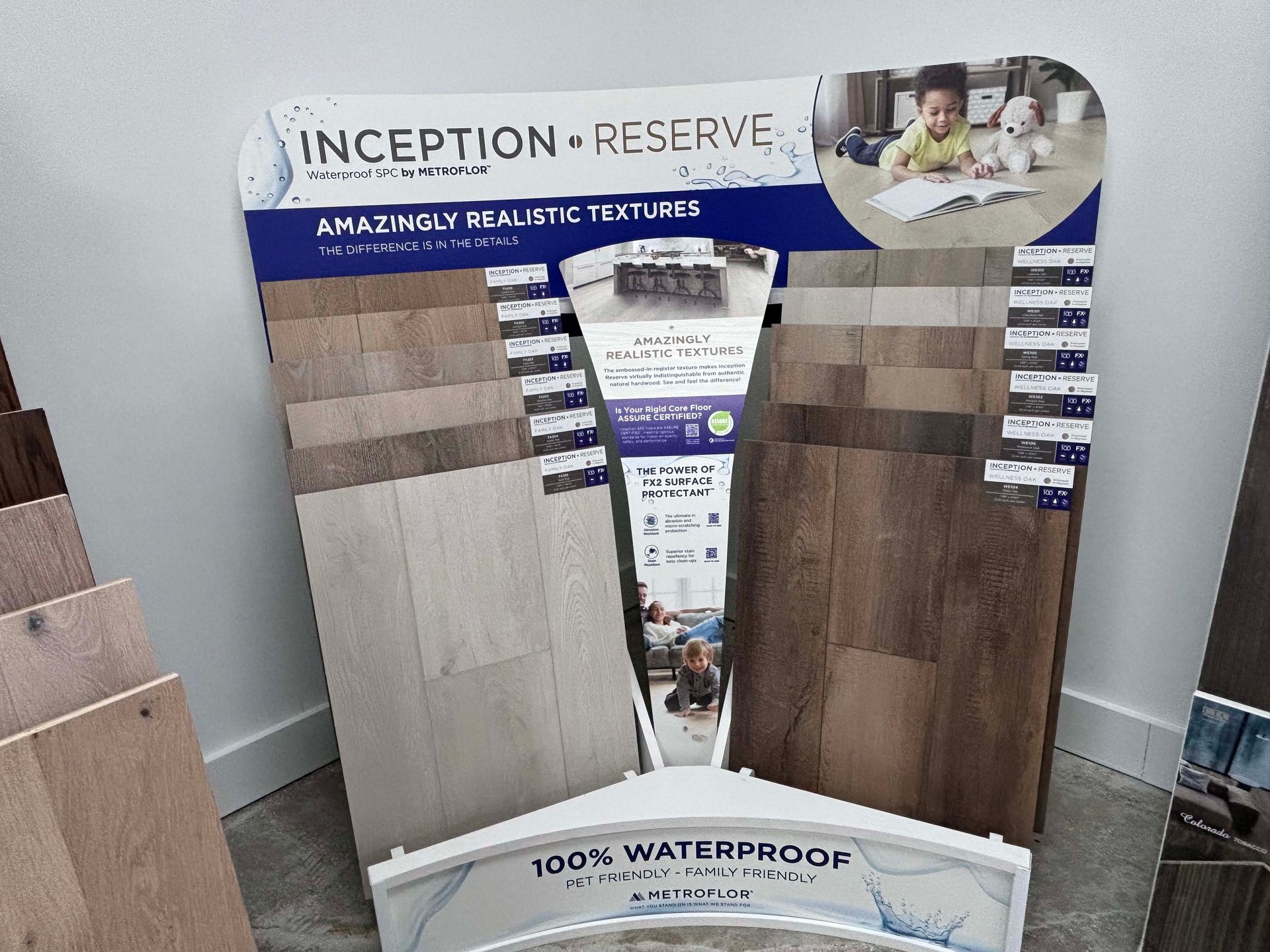 A display of inception reserve flooring is sitting on a table.