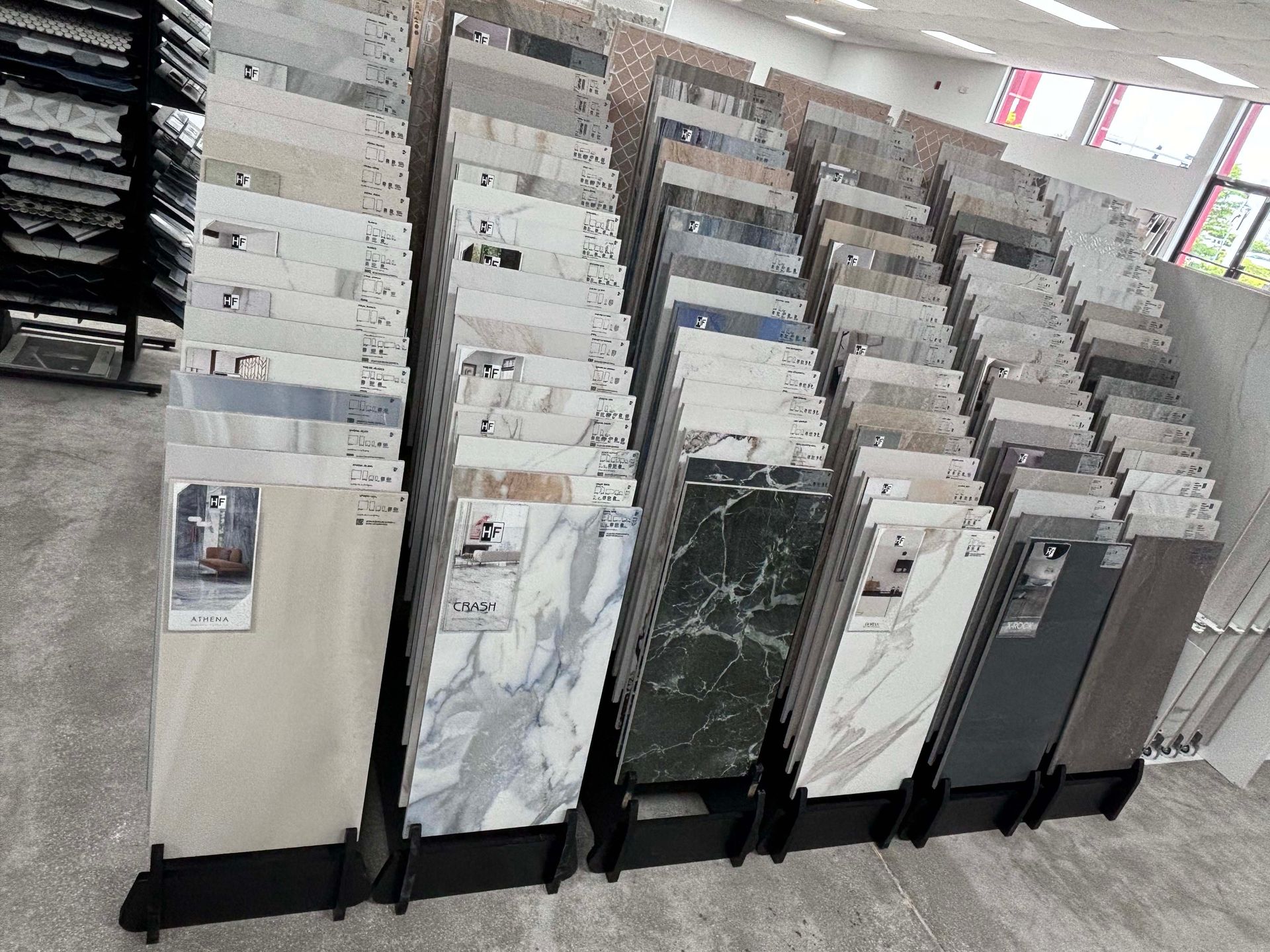 There are many different types of tiles on display in this store.