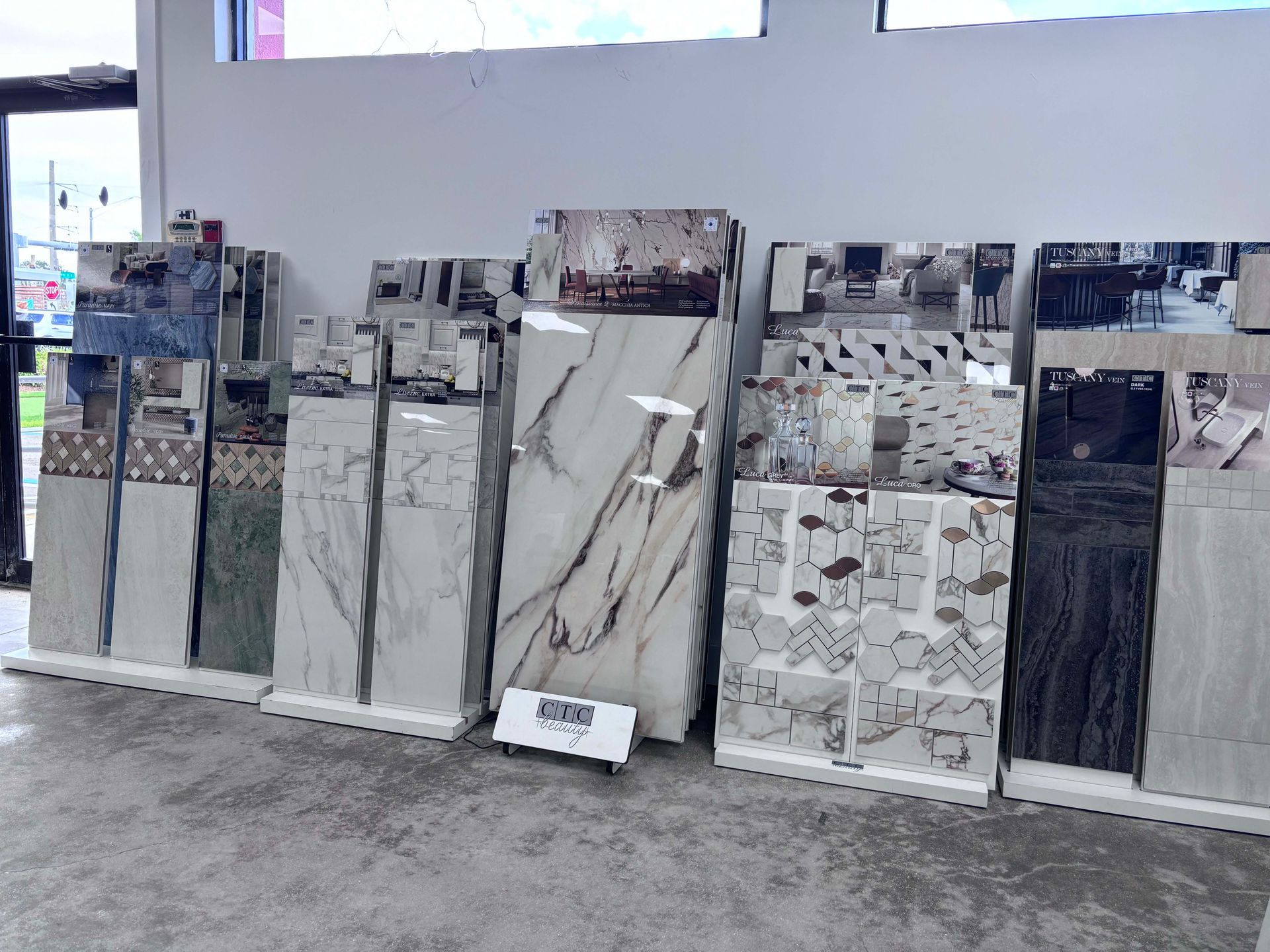 There are many different types of tiles on display in this store.