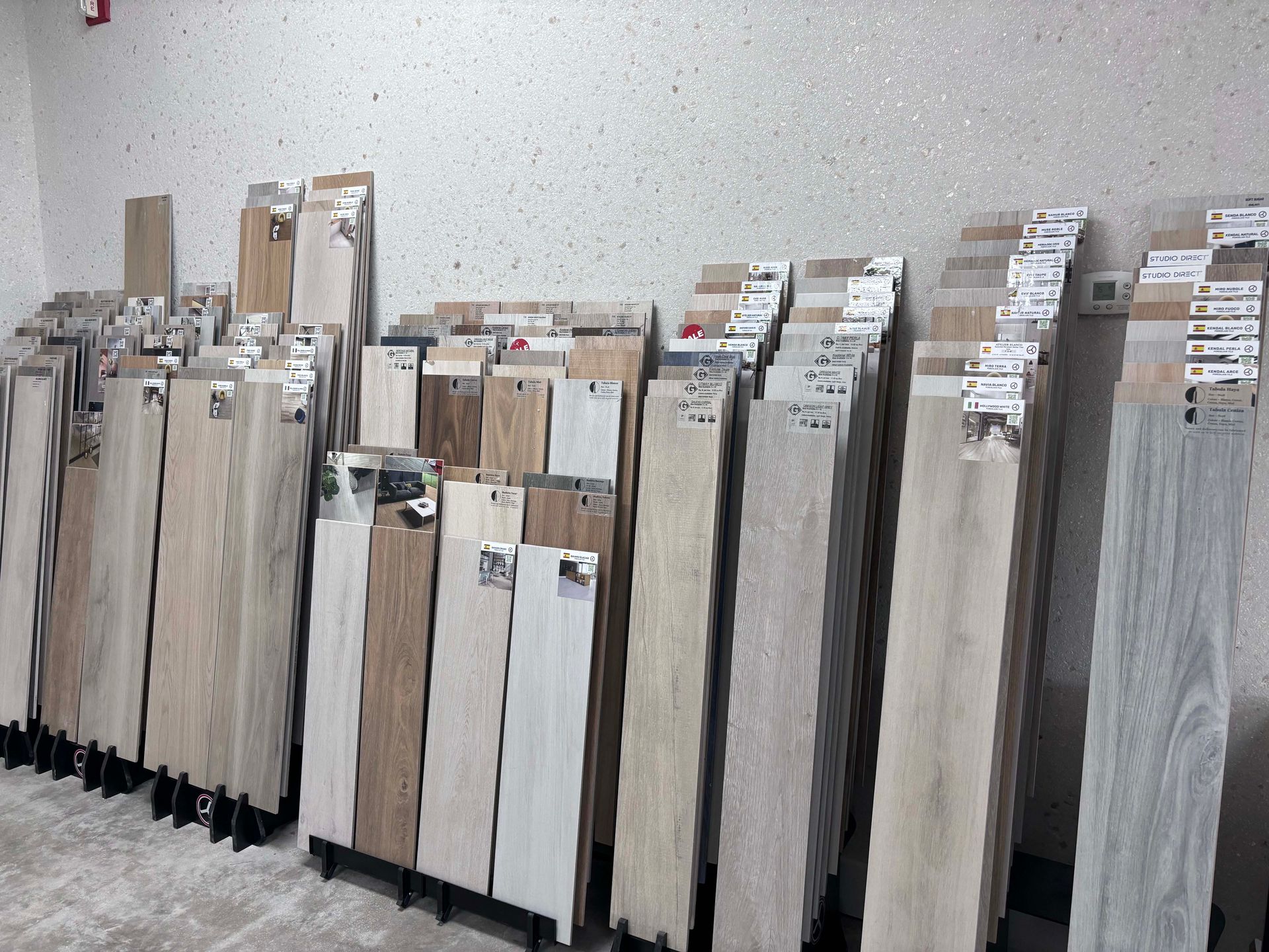 A room filled with lots of different types of wooden flooring.