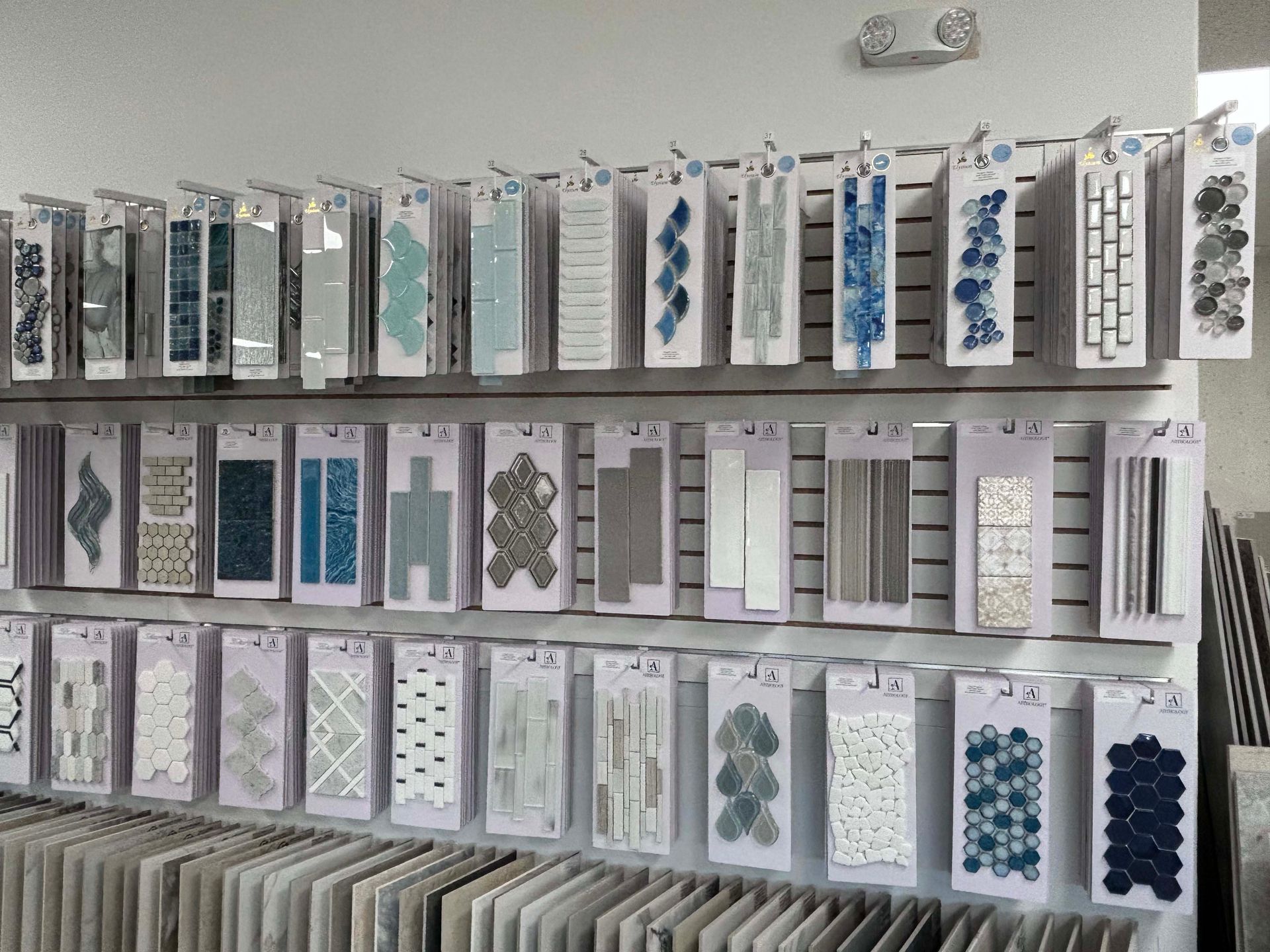 There are many different types of tiles on display in this store.