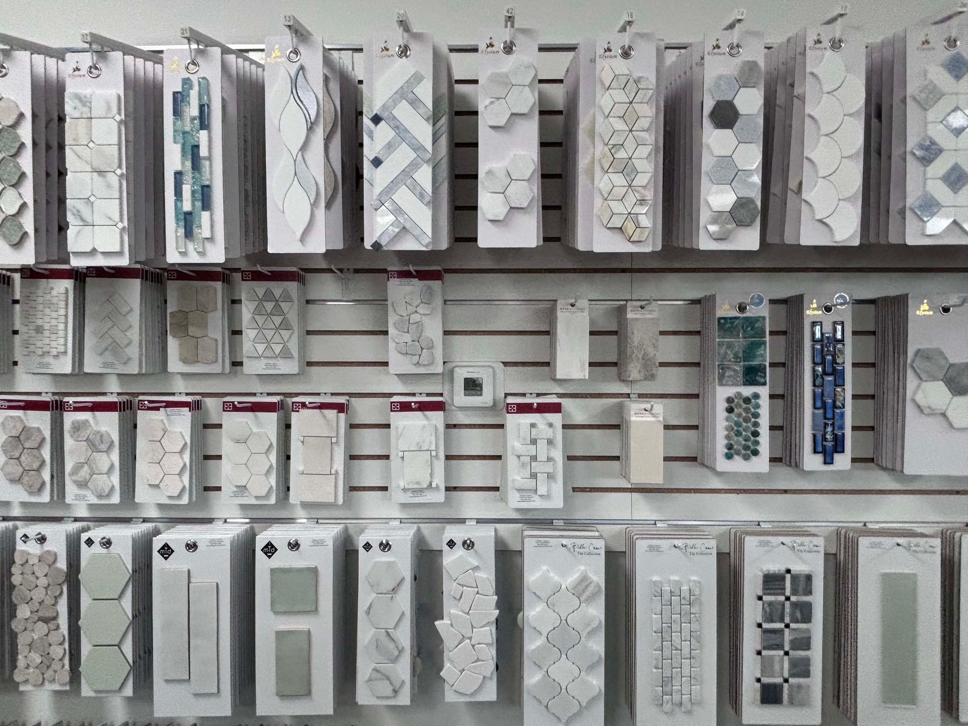 There are many different types of tiles on display in this store.