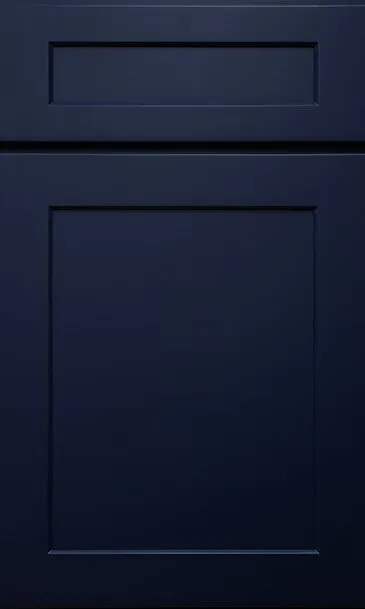 Dark blue cabinet door with recessed paneling.
