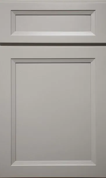Gray painted cabinet door with recessed panel and upper accent.