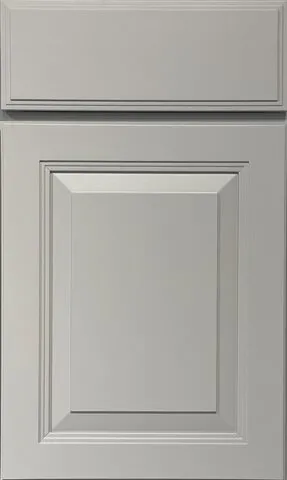 Gray kitchen cabinet door with raised panel and decorative trim.