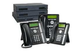 A group of telephones sitting next to each other on a white background.