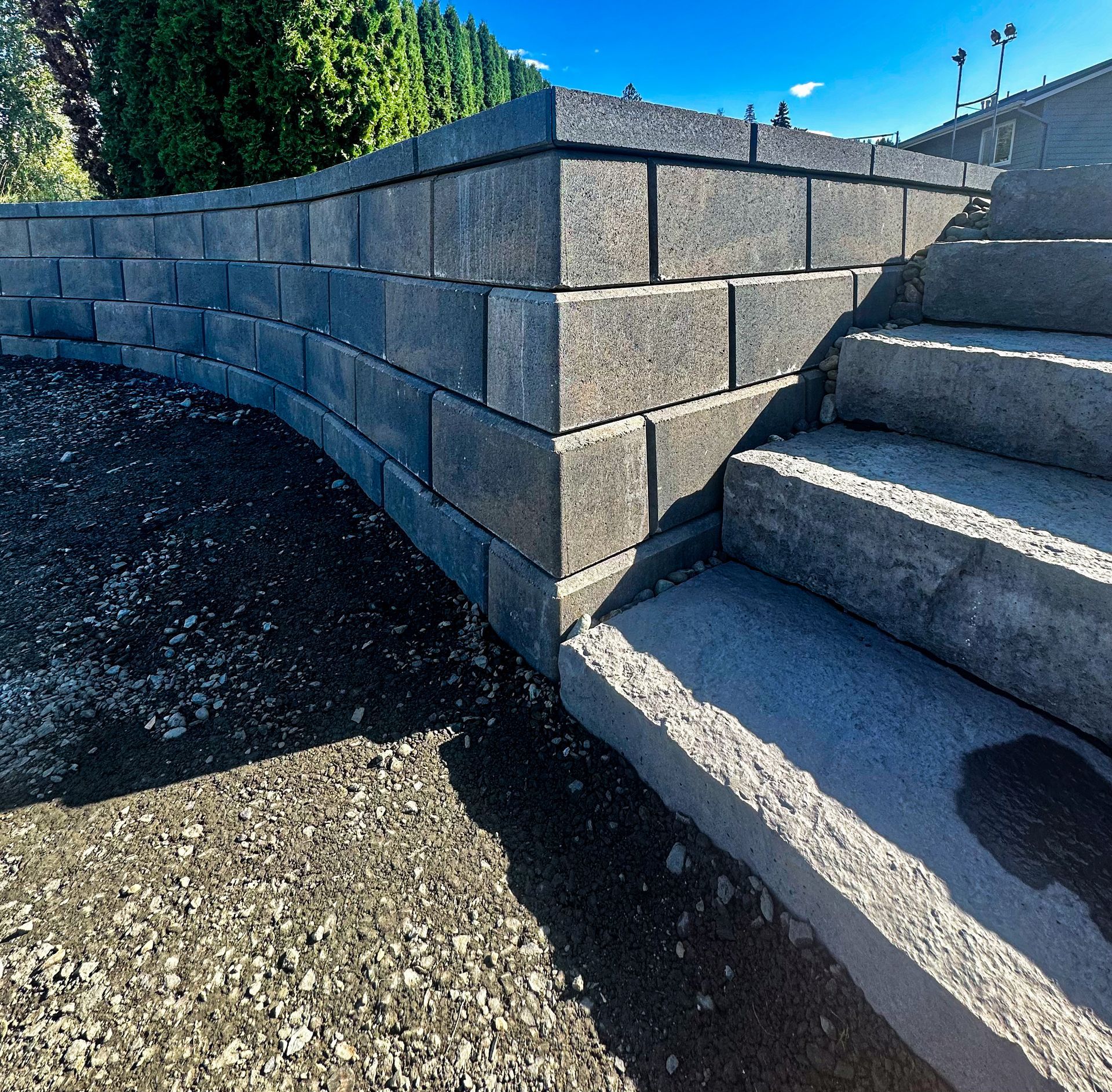 A brick wall with stairs leading up to it
