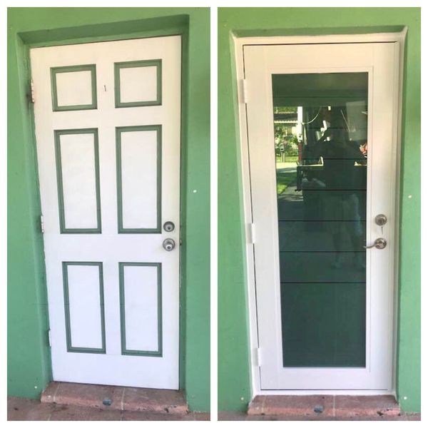 Two white doors, one solid and one glass, both with green trim, set in a green wall.