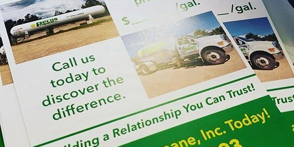 Flyers advertising propane service with images of a tank and truck. Text includes 