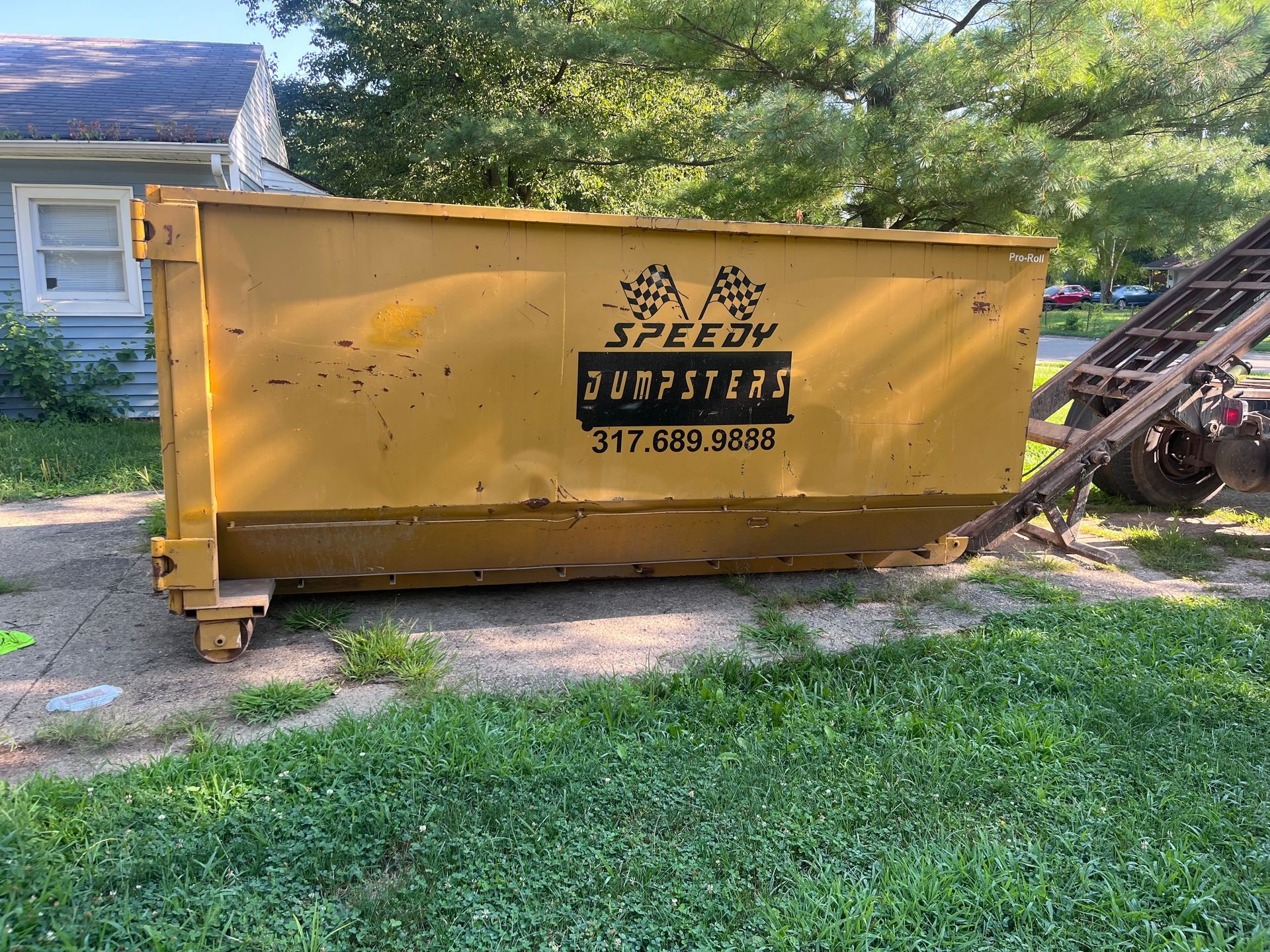 Yellow dumpster with 