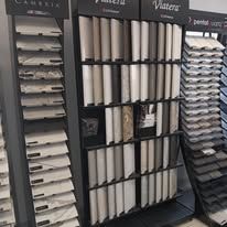 There are many different types of tiles on display in this store.