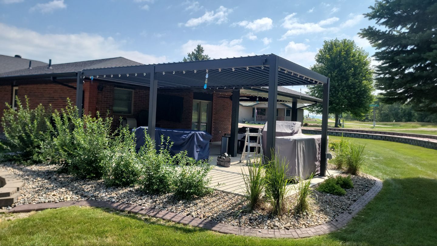 A house with a pergola and a hot tub in the backyard.