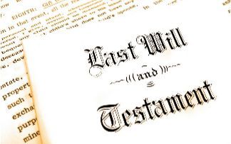 Last Will and Testament document on a tilted white page with ornate black lettering