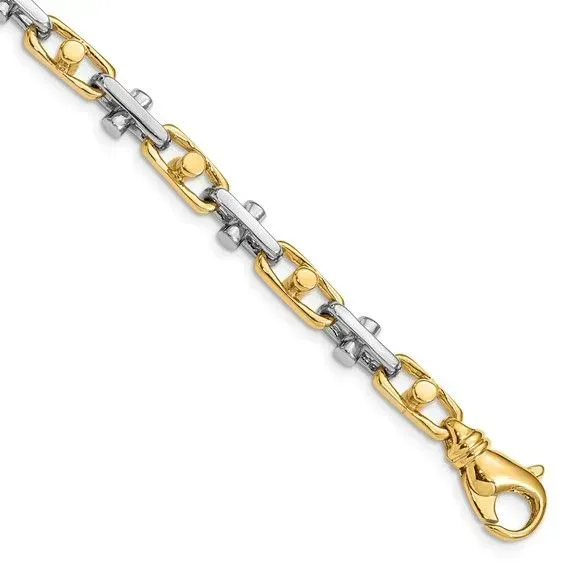 A close up of a gold and silver chain with a clasp