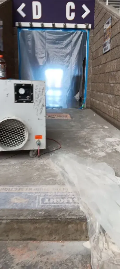 An entrance to D and C with an air conditioning unit.