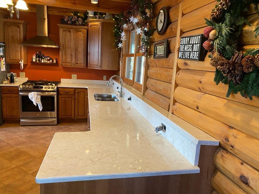 A kitchen in a log cabin decorated for christmas