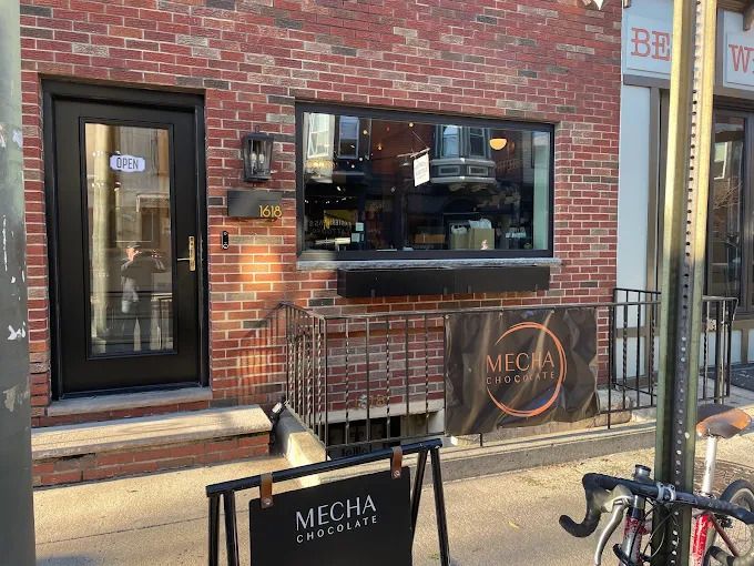 A brick building with a sign that says mecha chocolate