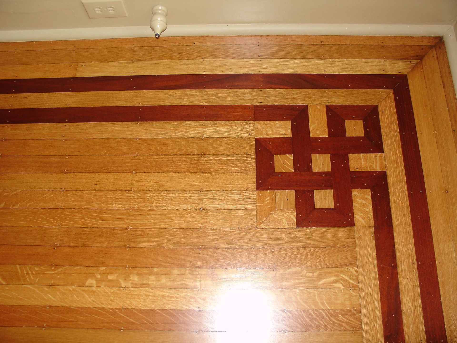 A wooden floor with a design on it.
