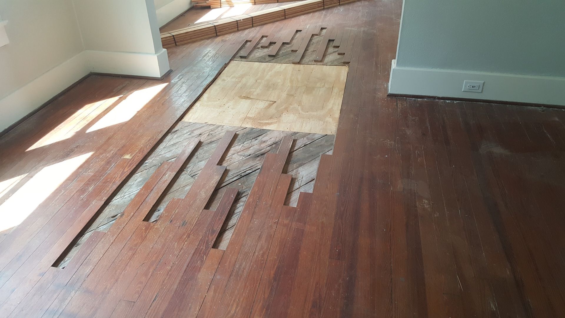 A wooden floor with a lot of pieces of wood on it.