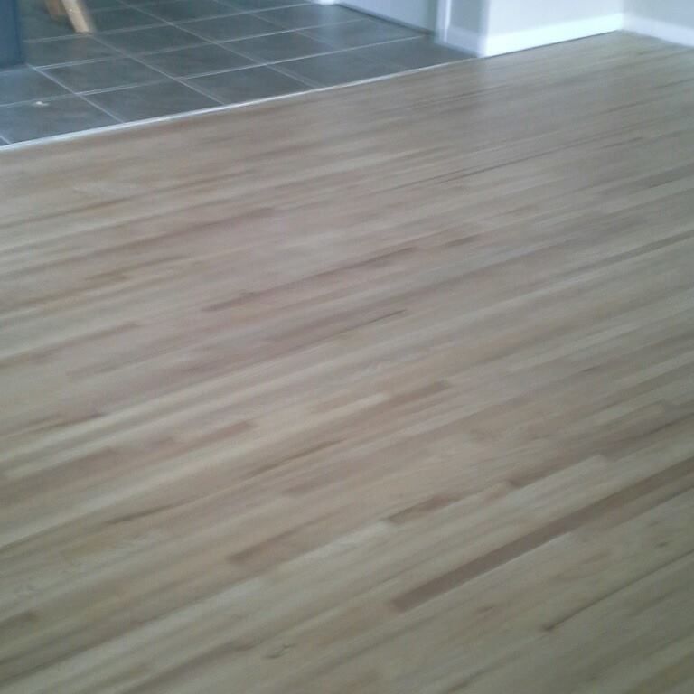 A close up of a wooden floor in a room.