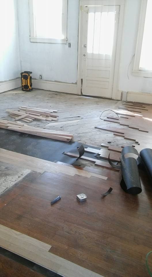 A room with a wooden floor and tools on it.