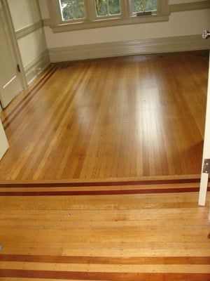 A room with a wooden floor and a window