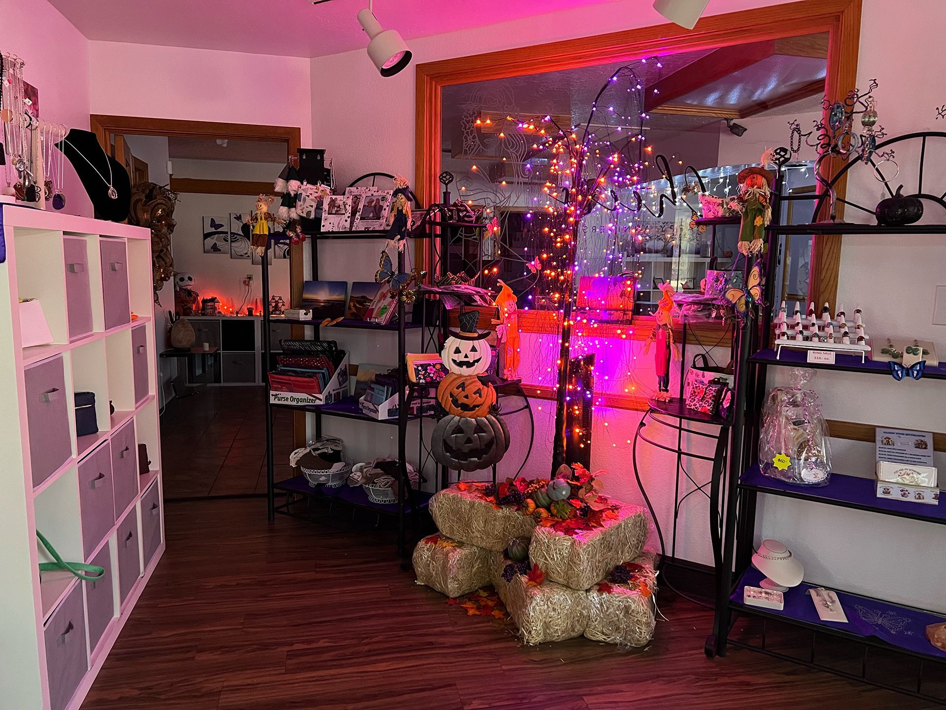 A room filled with lots of shelves and decorations for halloween.