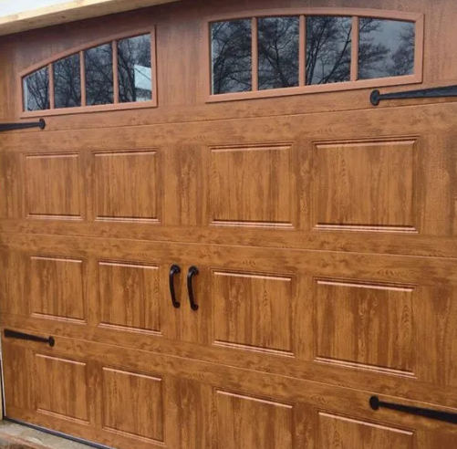 Wooden garage door with four arched windows and black handles