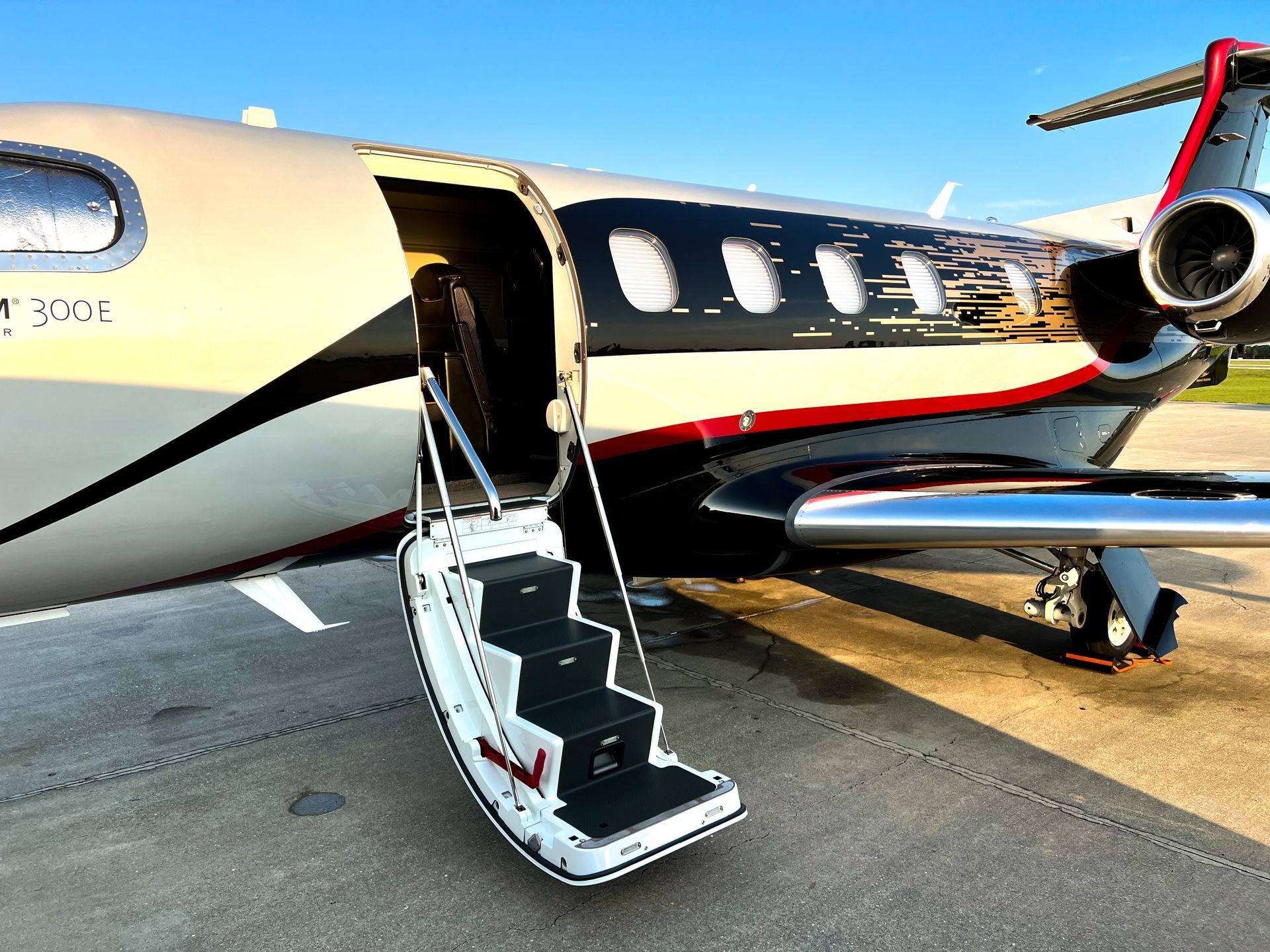 A small private jet with stairs leading up to it