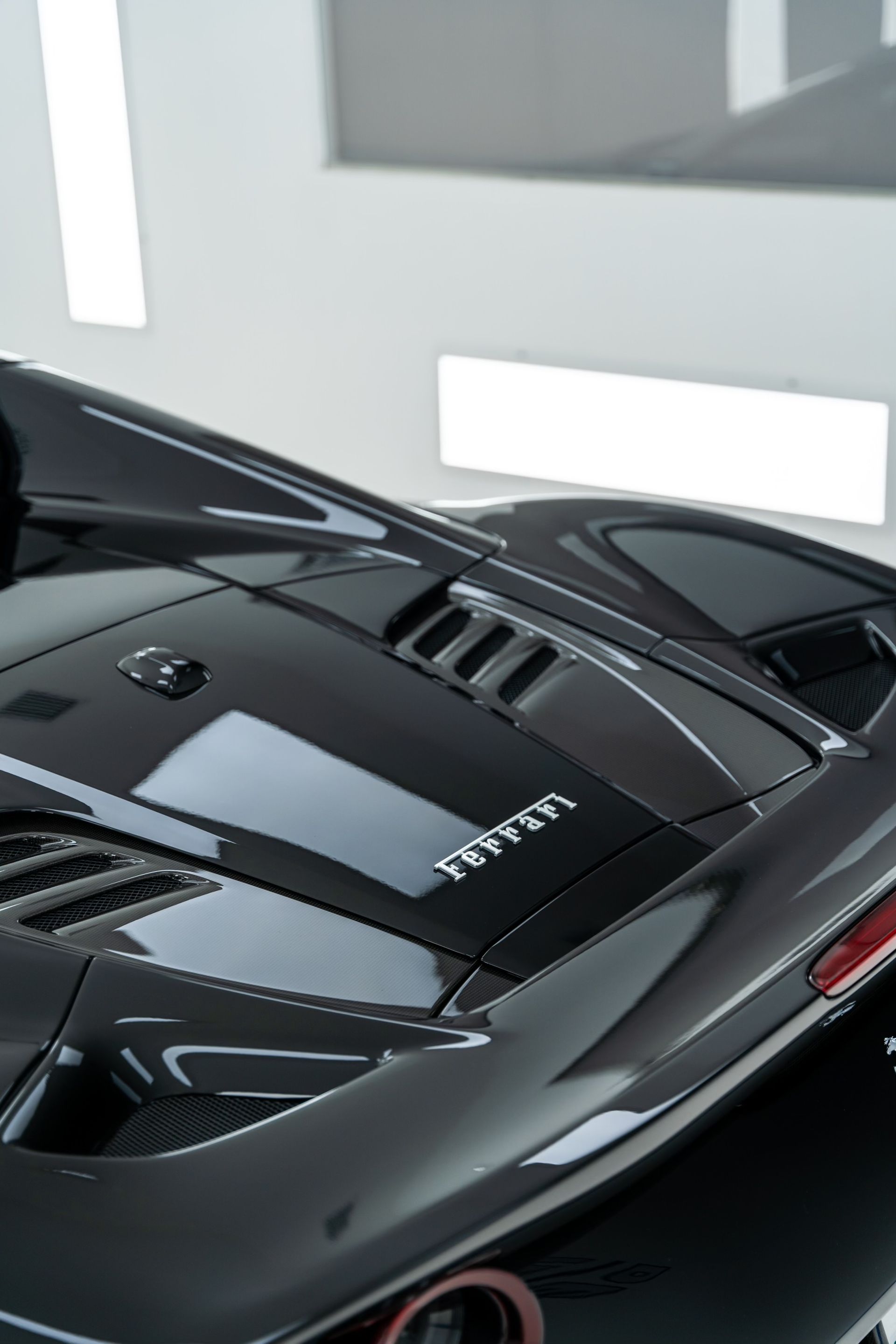 A close up of the hood of a ferrari sports car