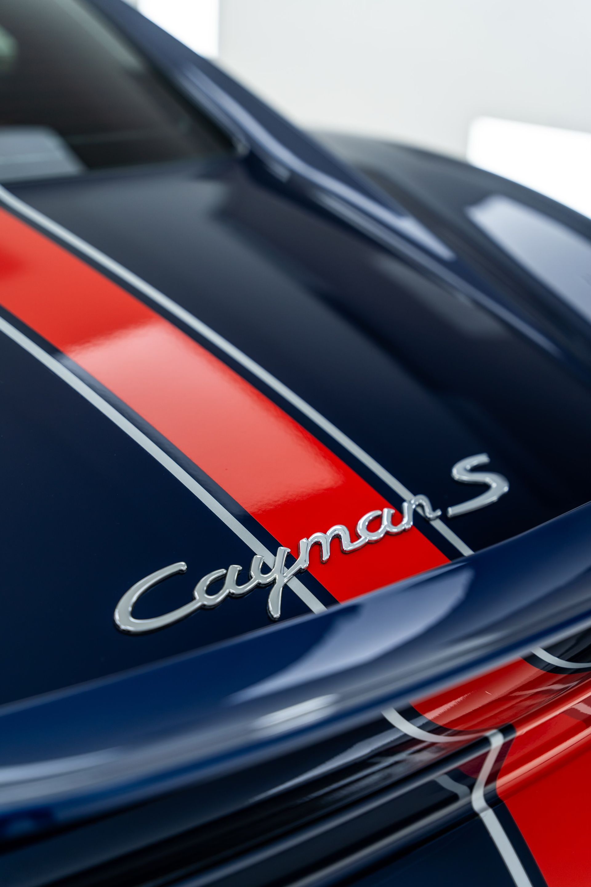 A close up of the hood of a porsche cayman s