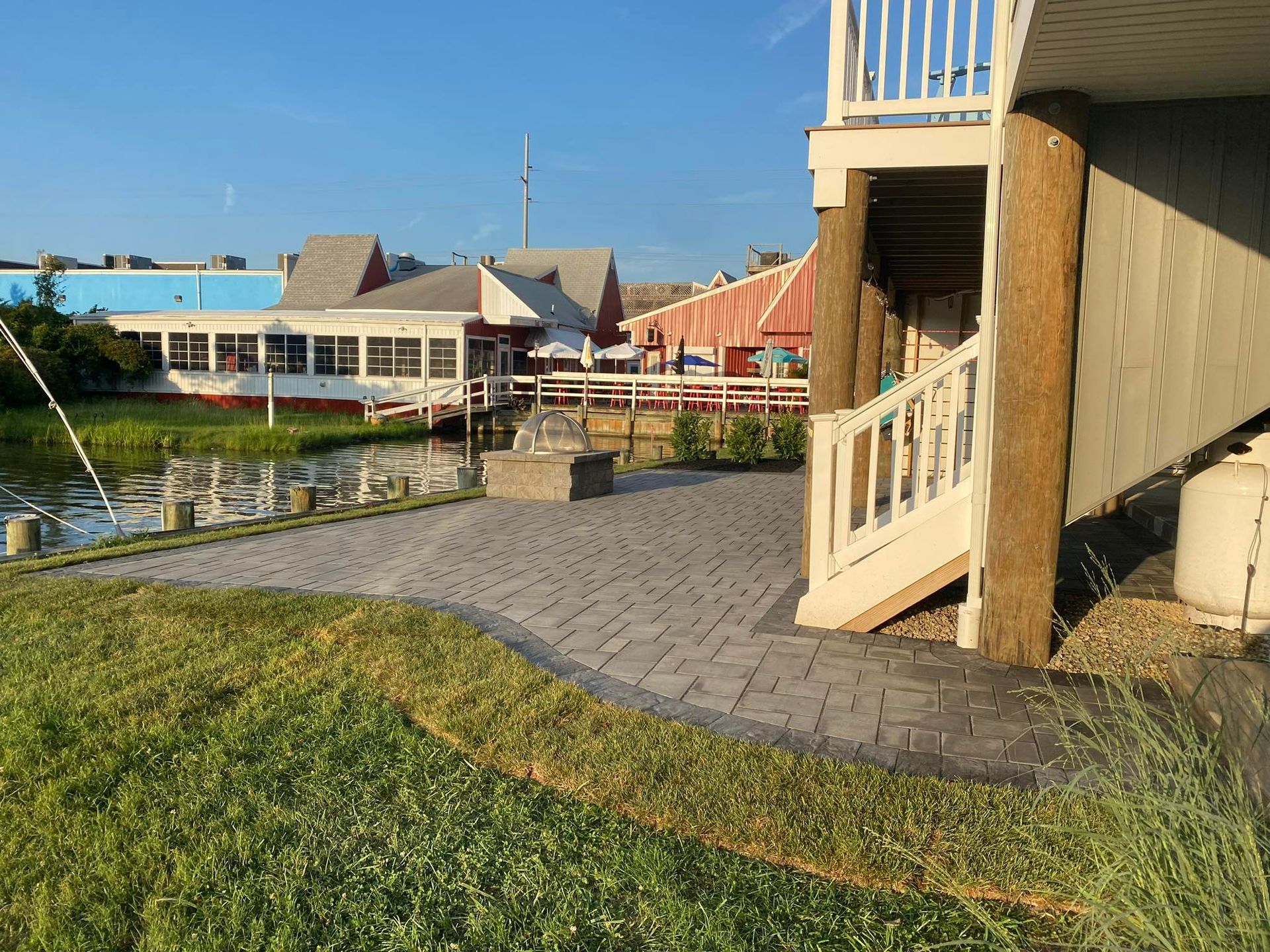 A house with a patio and stairs leading up to it.