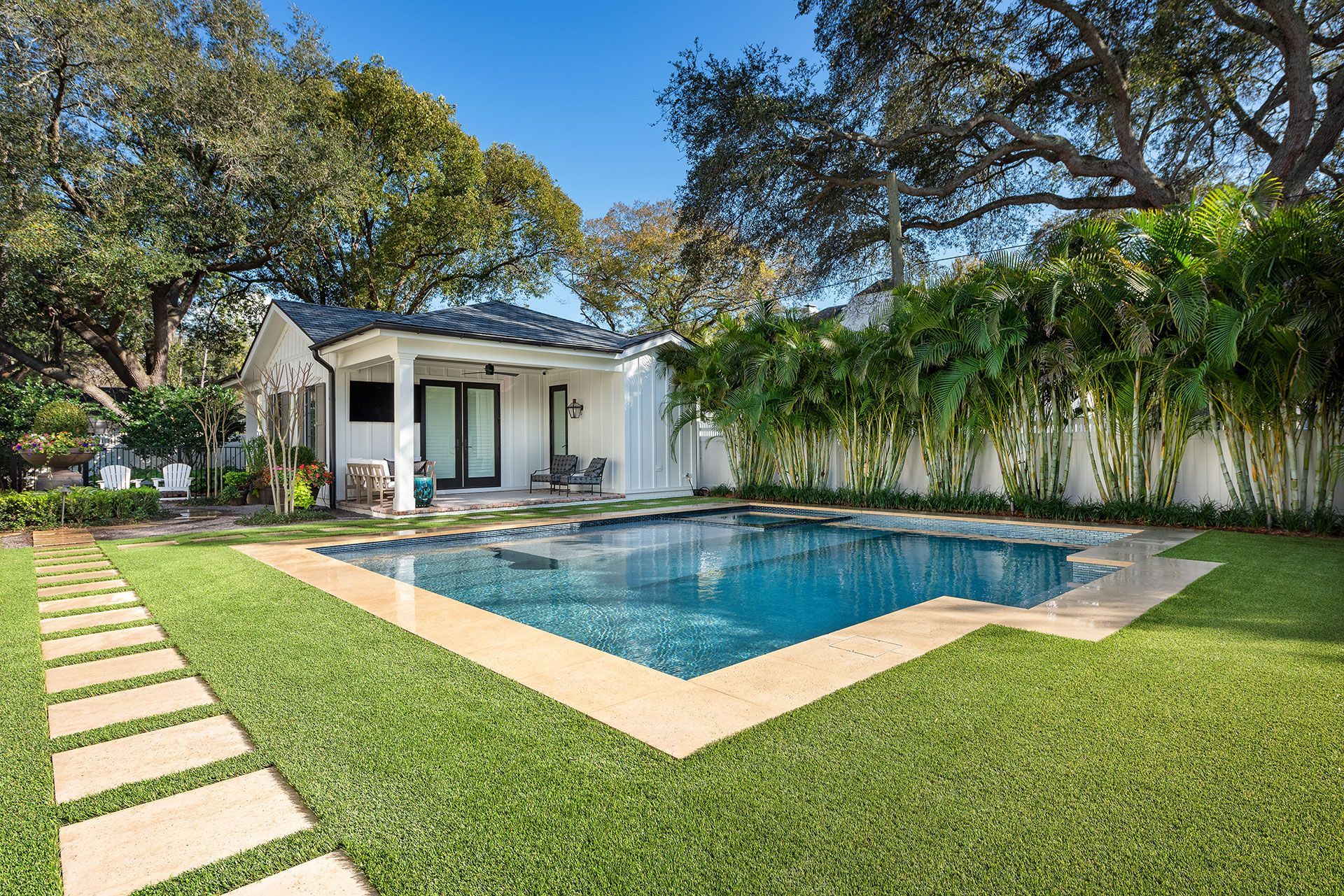 swimming pool beside patio
