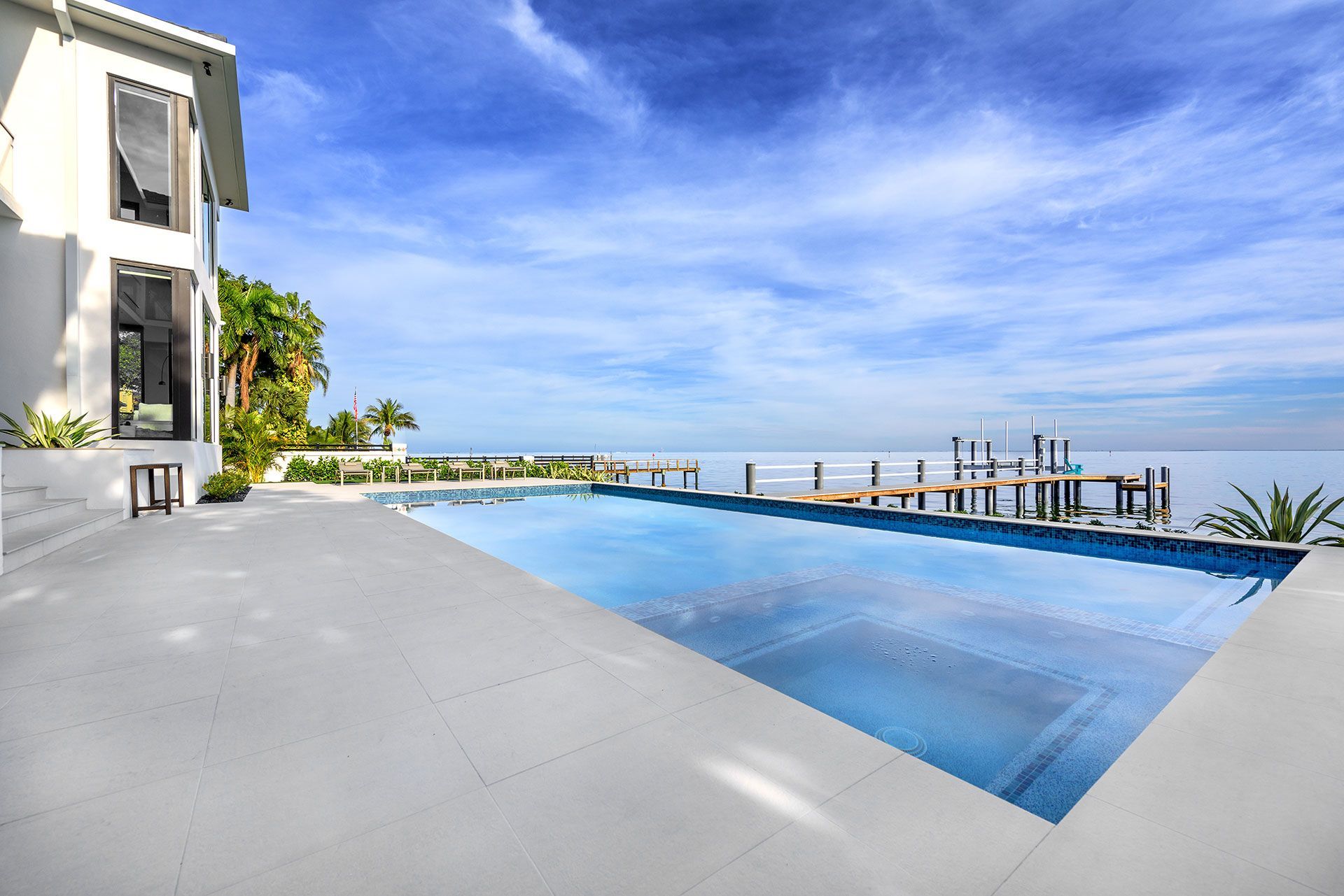 swimming pool beside an ocean