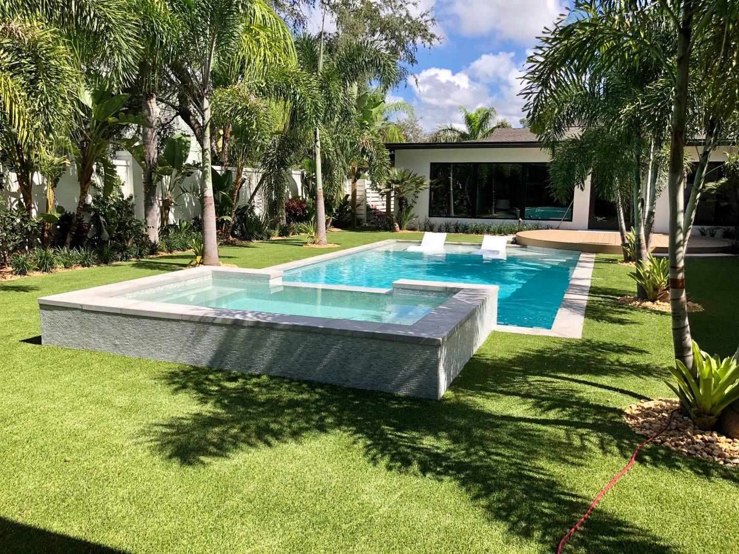 pool with lounge chairs