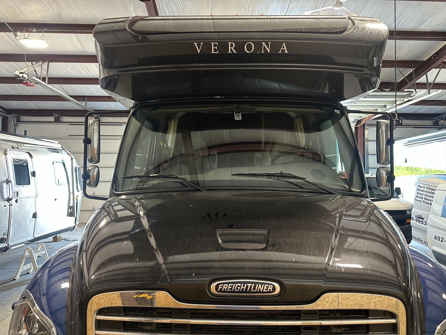 Front view of a dark grey Verona RV with 