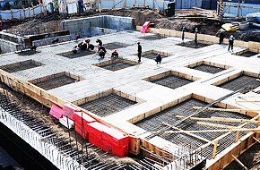 Men doing concrete construction