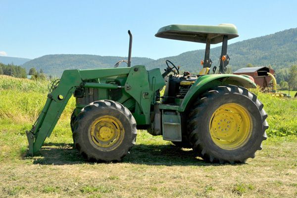 Green farm tractor