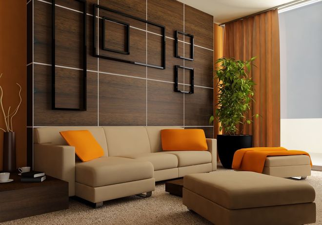 Modern living room with beige sectional sofas, orange pillows, wood accent wall, and indoor plant.