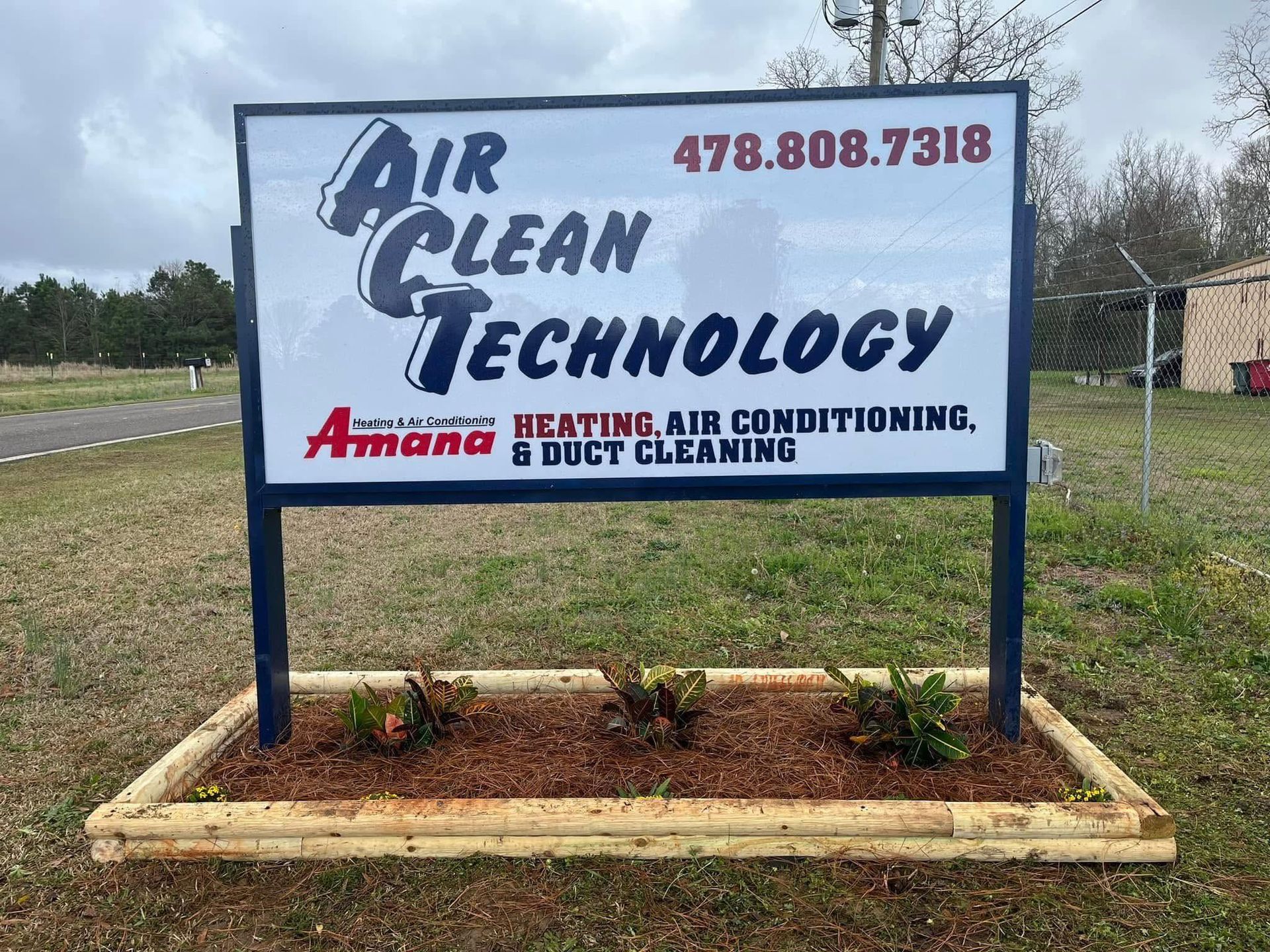 Air Clean Technology roadside sign with phone number and HVAC, air conditioning, and duct cleaning services.