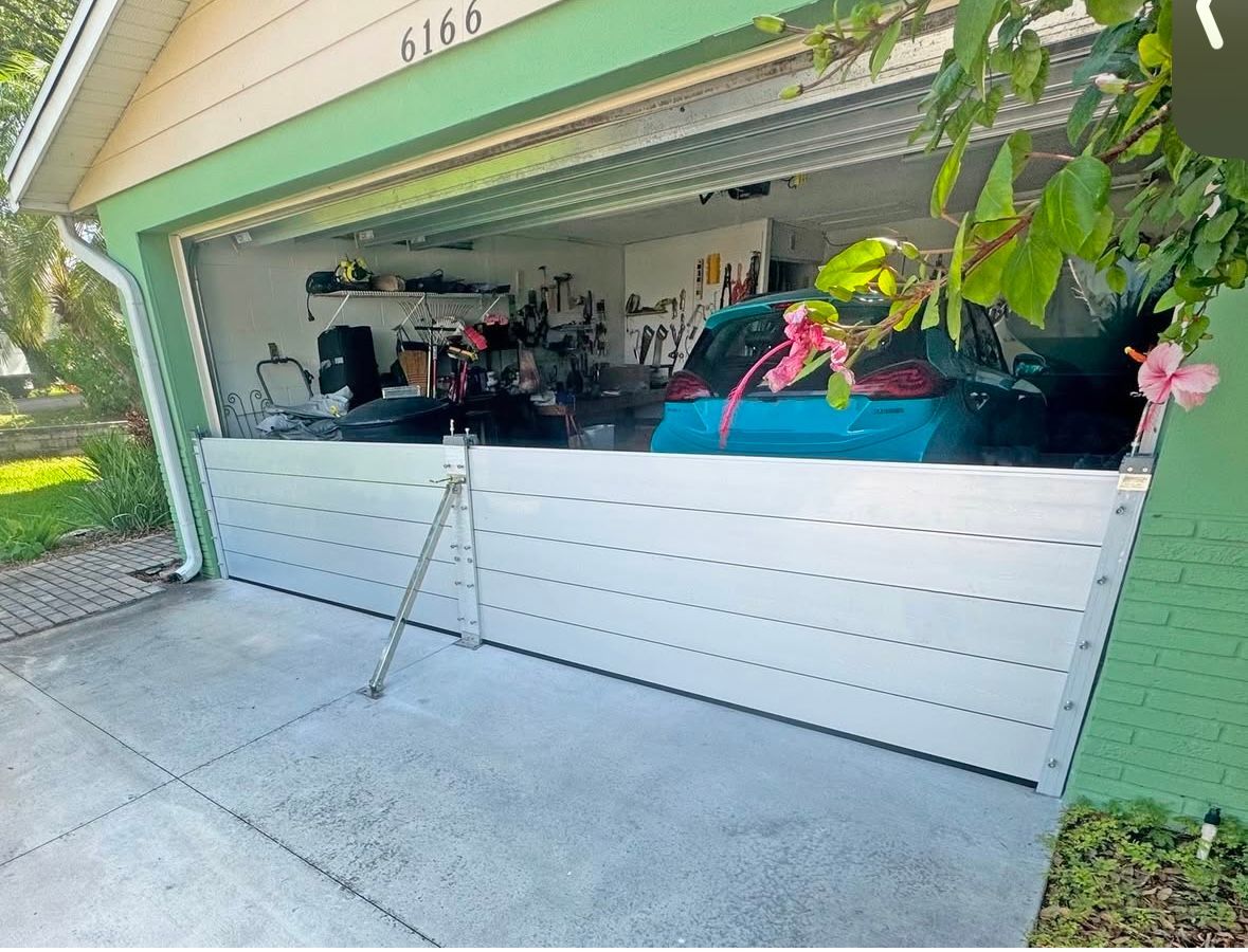Open garage with waist-high flood barriers