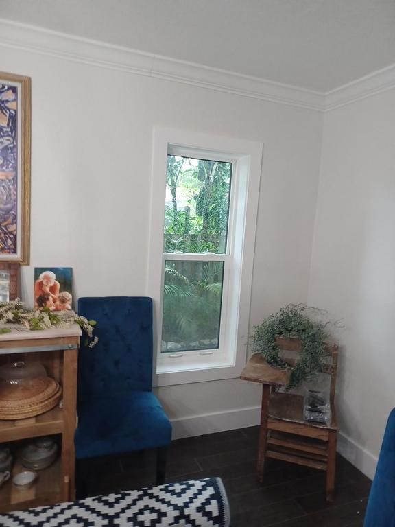 White window in a cozy living room corner